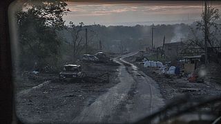 The gutted remains of cars lie along a road during heavy fighting at the front line in Severodonetsk, Luhansk region, Ukraine