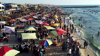Palestinians swim in Mediterranean sea off a beach in Gaza's Beit Lahia