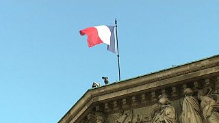 The French flag flying over the National Assembly