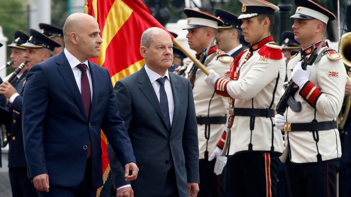 German Chancellor Olaf Scholz, with North Macedonia's Prime Minister Dimitar Kovachevski, reviewing an honour guard in Skopje, North Macedonia, on Saturday, June 11, 2022.