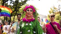 FILE - Participants gather during the annual Gay pride Rainbow Parade, in Vienna, Austria, Saturday, June 11, 2022. (AP Photo/Theresa Wey)