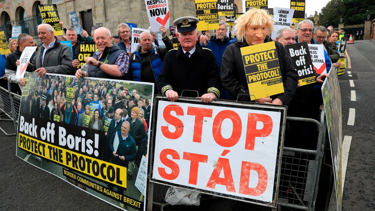 Demonstrators protest outside Hillsborough Castle, ahead of a visit by British Prime Minister Boris Johnson, in Hillsborough, Northern Ireland, May, 16, 2022.