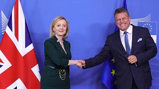 European Commissioner Maros Sefcovic, right, and UK Foreign Secretary Liz Truss prior to a meeting  in Brussels, Feb. 21, 2022.
