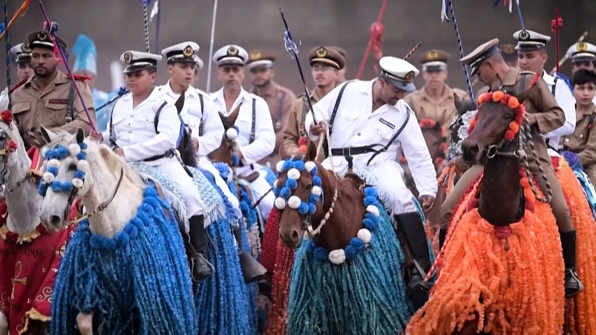 Men riding horses take part in traditional festival Cavalhada in Brazil