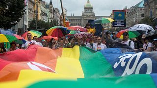 Participants deploy a giant rainbow flag during the 9th gay pride event in the Czech capital Prague on August 10, 2019