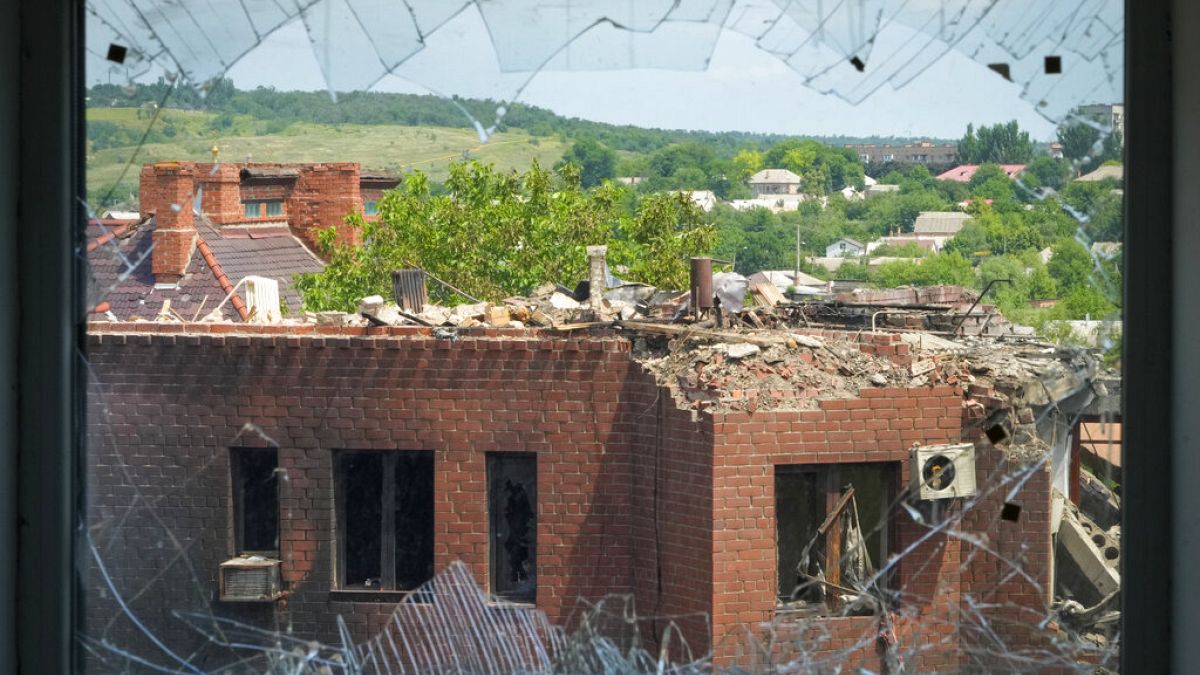 A heavily damaged house following Russian night shelling is seen through a broken window, in the town of Bakhmut, Donetsk region, Ukraine