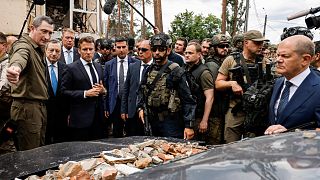 French President Emmanuel Macron, third left, Italian Prime Minister Mario Draghi, second left, and German Chancellor Olaf Scholz, right, visit Irpin, Ukraine