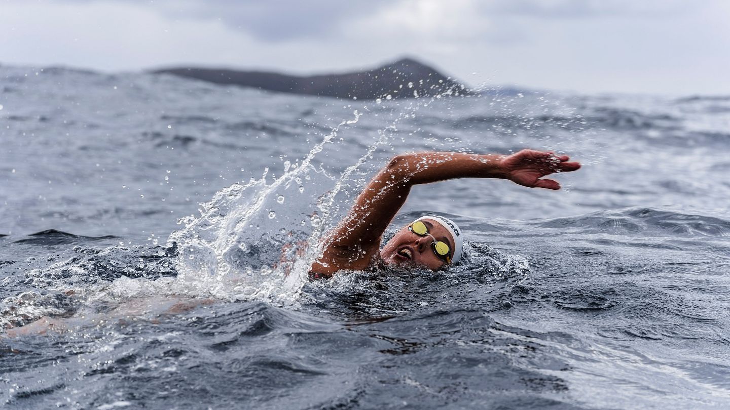 Ice swimmer breaks two world records crossing the world's most