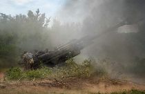 Ukrainian soldiers fire at Russian positions from a US-supplied M777 howitzer in Donetsk, 18 June 2022