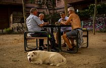 Men play cards during a hot day in Madrid, Spain, June 17, 2022. 