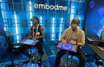 Musicians demonstrate Embodme's MIDI controller at the Vivatech conference in Paris.