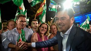 Partido Popular (PP) candidate for the Andalusian regional election Juanma Moreno greets supporters following the Andalusian regional elections, in Seville on June 19, 2022.