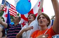 Demonstrators sing the national anthem during a public rally in Tbilisi, Georgia, June 20, 2022, to show support for the country's EU membership bid.