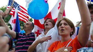 Demonstrators sing the national anthem during a public rally in Tbilisi, Georgia, June 20, 2022, to show support for the country's EU membership bid.