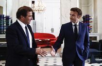 French President Emmanuel Macron, right, shakes hands with Christian Jacob, head of Les Republicains party after their meeting at the Elysee Palace in Paris, 21 June 2022.