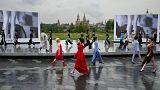 Models display a collection during the Fashion Week at Zaryadye Park near Red Square in Moscow