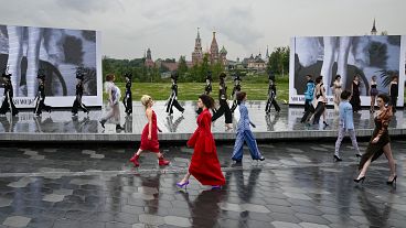 Models display a collection during the Fashion Week at Zaryadye Park near Red Square in Moscow