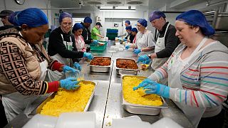 Volunteers from the charity 'The Felix Project' prepare meals in the kitchen of their hub, London, May 4, 2022. The cost of food in the UK has risen sharply in recent months.