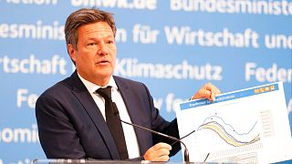 German Economy Minister Robert Habeck shows an diagram about German gas storage