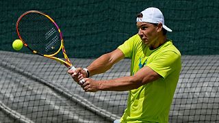 Spain's Rafael Nadal plays a return as he practices ahead of the Wimbledon tennis championships in London, Sunday, June 26, 2022.