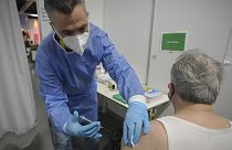 A man receives a COVID-19 vaccine on the second day of a national lockdown to combat soaring coronavirus infections in Vienna, November 2021