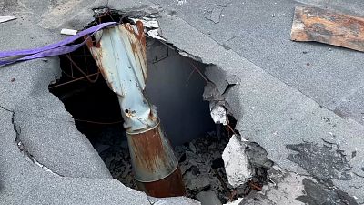 Rescuers remove 500kg bomb from roof in Kharkiv