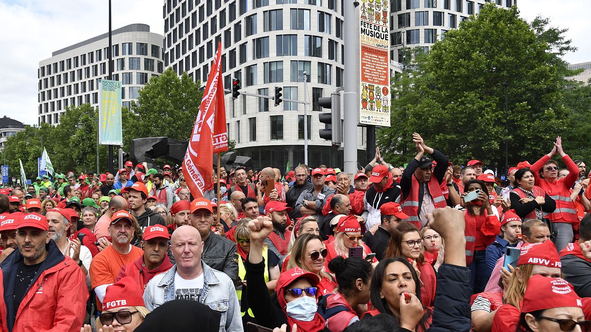 Members of various trade unions march during a demonstration in Brussels on June 20.