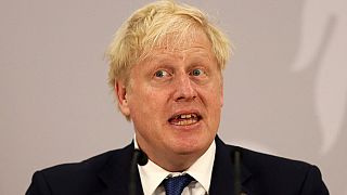 Boris Johnson addresses a press conference during the Commonwealth Heads of Government Meeting (CHOGM) at Lemigo Hotel in Kigali on June 24, 2022.