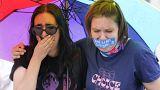 Abortion-rights activists in the US react after hearing the Supreme Court decision on abortion outside the Supreme Court in Washington, Friday, June 24, 2022.