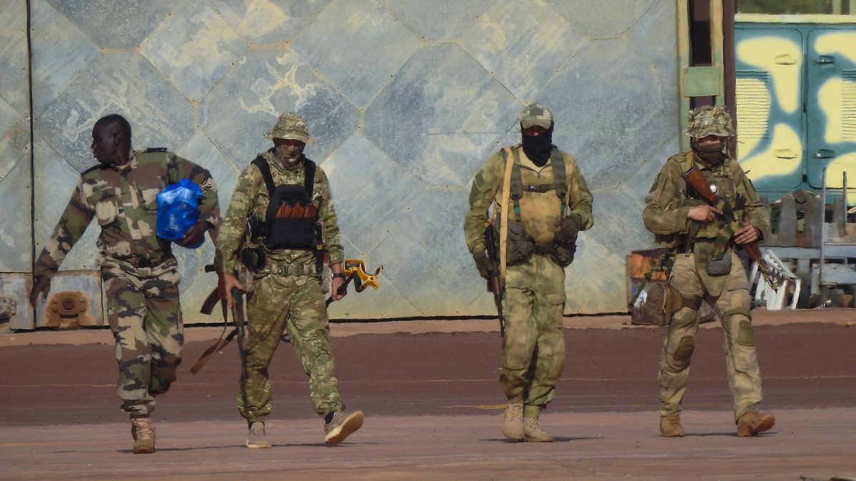 An undated file photograph issued by French military shows three Russian mercenaries, right, in northern Mali. 