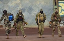 An undated file photograph issued by French military shows three Russian mercenaries, right, in northern Mali.