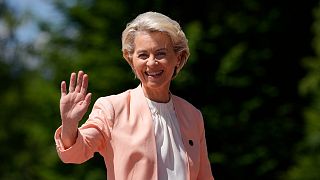 European Commission President Ursula von der Leyen waves as she arrives for the official G7 summit