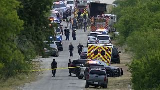 Police work the scene where dozens of people were found dead in a semitrailer in a remote area in southwestern San Antonio, Monday, June 27, 2022.