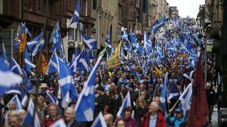Thousands of people take part in the 'All Under One Banner' march for Scottish independence through Glasgow city centre, Scotland, Saturday, July 30, 2016.