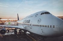 Aviation giant Lufthansa apologises to customers and warns of continuing summer travel disruptions.