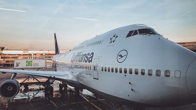 Aviation giant Lufthansa apologises to customers and warns of continuing summer travel disruptions. 