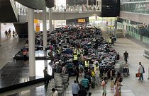 After a luggage system failure, piles of unclaimed baggage at Heathrow airport have begun to smell.