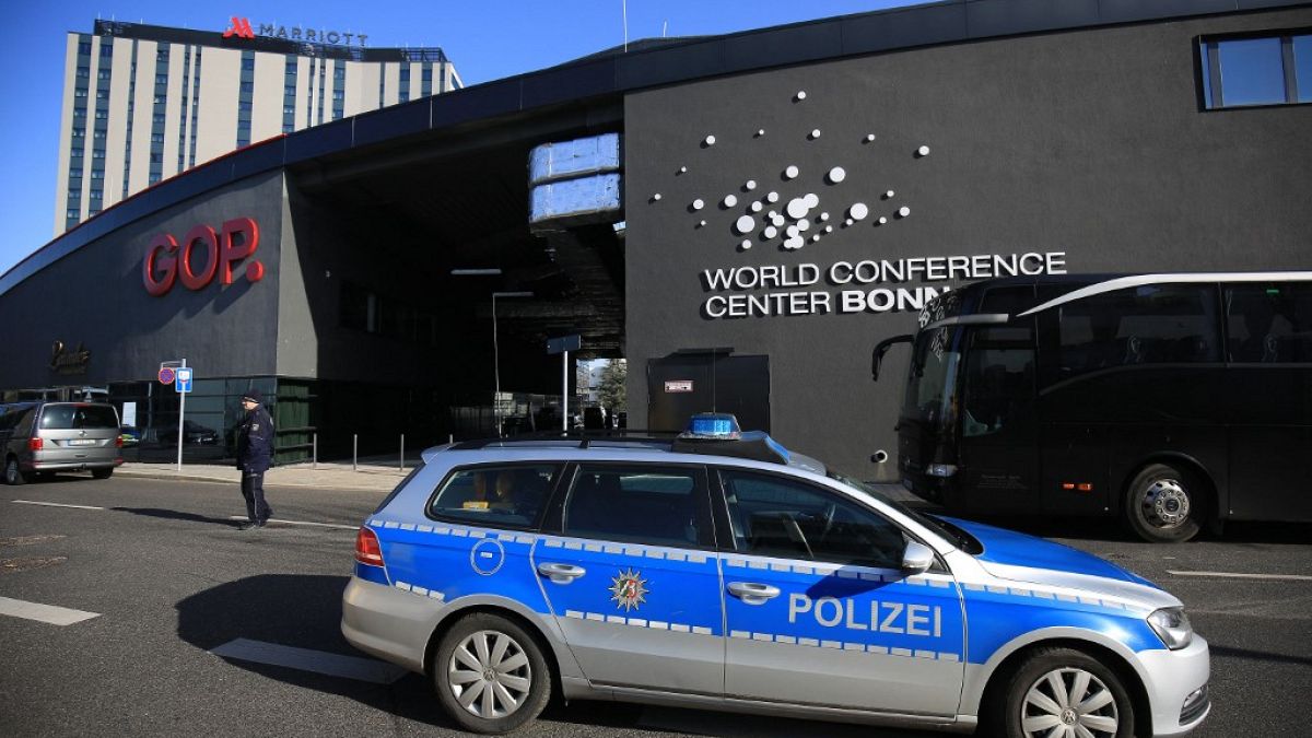 A police car stands in front of the World Conference Center in Bonn in 2017.