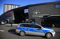 A police car stands in front of the World Conference Center in Bonn in 2017.