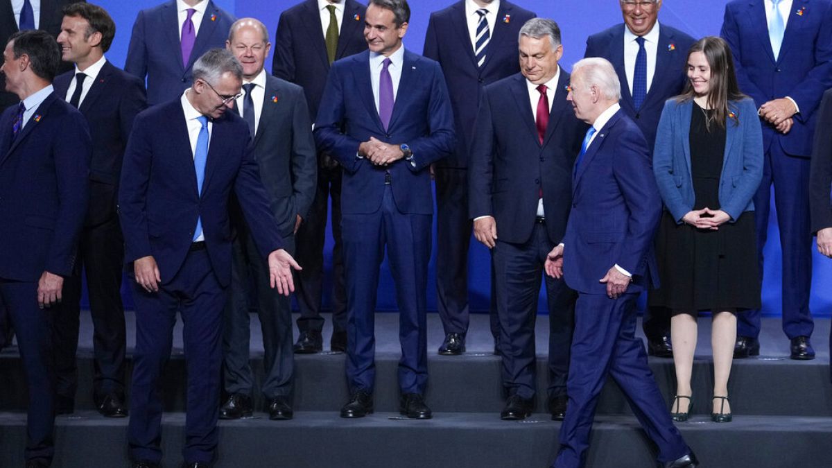 U.S. President Joe Biden, front right, arrives for a group photo during the NATO summit in Madrid