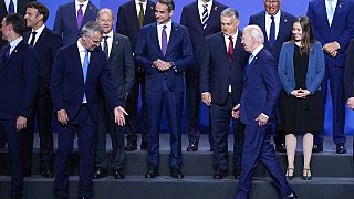 U.S. President Joe Biden, front right, arrives for a group photo during the NATO summit in Madrid