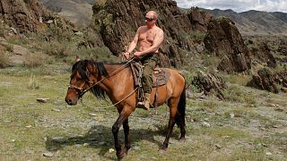 Vladimir Putin is pictured riding a horse in the Siberian mountains in the Tyva region in August 2009.