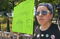 Erin Tinerella, of Chicago, who is in Washington for the summer at an internship, protests against climate change after the Supreme Court's EPA decision, June 30, 2022.