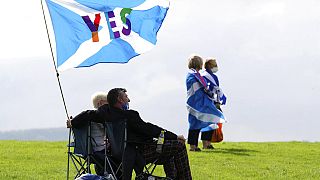 People take part in the All Under One Banner Scottish independence demonstration near Stirling, Scotland, Wednesday, Aug. 19, 2020. 