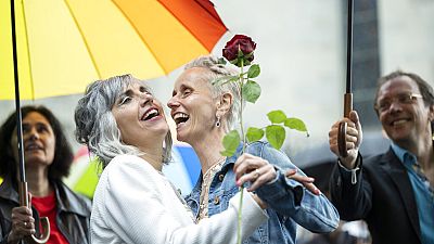 Annett Babinsky, right, and Laura Suarez celebrate their marriage at the registry office 'Amtshaus' in Zurich, Switzerland, July 1, 2022.