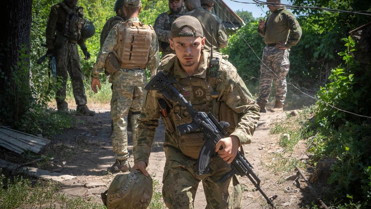 Ukrainian soldiers attend their positions, in the Donetsk region, Ukraine, Saturday, July 2, 2022.