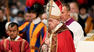 Pope Francis holds the crucifix as he celebrates a Mass on the Solemnity of Saints Peter and Paul, in St. Peter's Basilica at the Vatican, Wednesday, June 29, 2022.