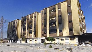 Libya's charred parliament building is seen in Tobruk, Libya, Saturday, July 2, 2022