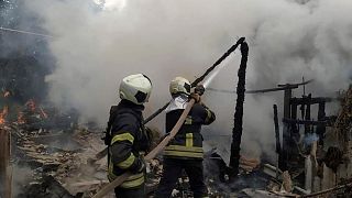 Ukrainian firefighters work to extinguish a fire at damaged residential building in Lysychansk, Luhansk region, Ukraine, early Sunday, July 3, 2022.