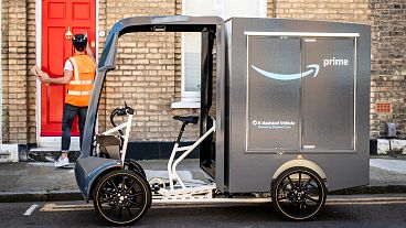 A new electric-cargo bike driven around London to mark the announcement of Amazon's first UK micromobility hub for more sustainable deliveries.